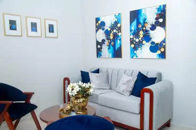 a living room with a couch and a table at Luxury Apartment in Santiago de los Caballeros