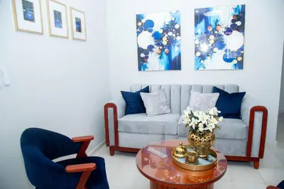 a living room with a couch and a table at Luxury Apartment in Santiago de los Caballeros