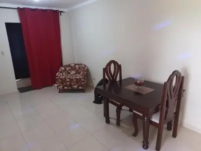 a dining room with a table and two chairs at Hermoso Apartamento Turístico in Colorado