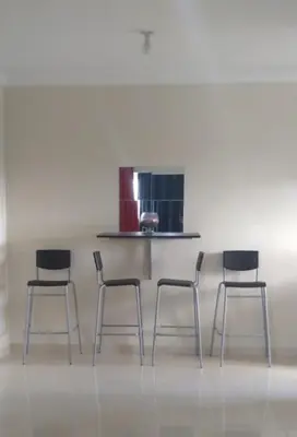 a group of four chairs in a room at Hermoso Apartamento Turístico in Colorado