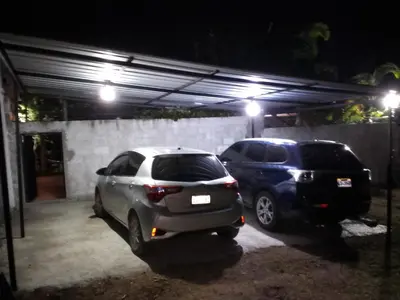 two cars parked in a parking lot at night at Villa Dupi in Colorado