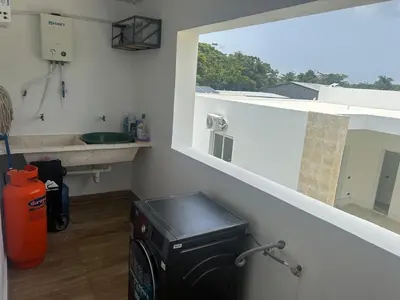 a small kitchen with a stove and a window at Beach and comfort in Las Terrenas
