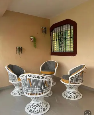 a room with four chairs and a mirror at El Rincon de Sanchez