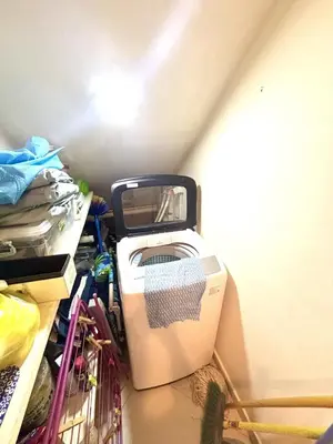 a washing machine is sitting in a room at Apartment en residence face à la Mer in Las Terrenas