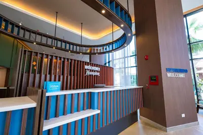 a lobby with a staircase in a building at Hotel Hampton By Hilton Santiago De Los Caballeros in Santiago de los Caballeros