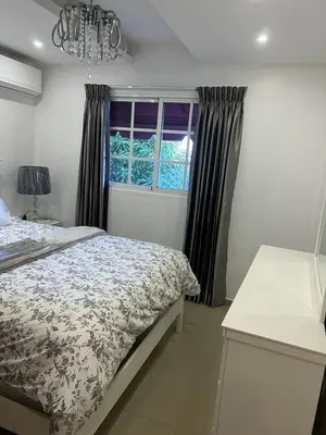 a bedroom with a bed and a window at Residencial Pancho III in Los Mameyes