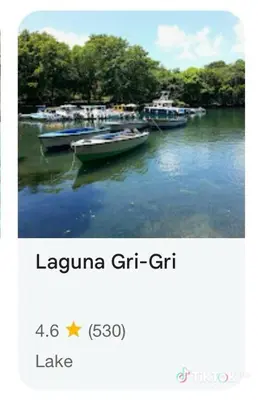 three boats are docked in the water on a lake at Room 4 in Río San Juan
