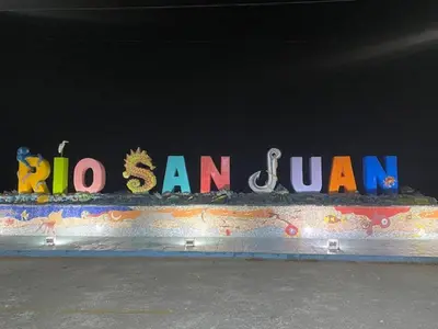 a sign that says hi san jam on a wall at Room 7 in Río San Juan