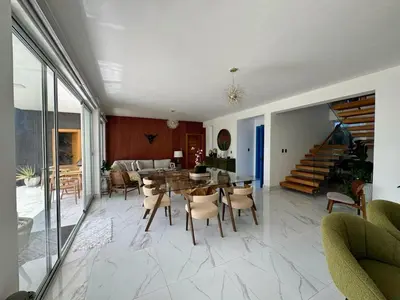 a dining room with a table and chairs at Villa Noah in Bayahibe