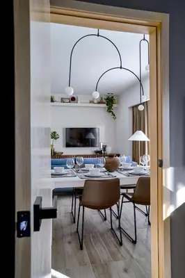 a dining room with a table and chairs at Regatta Living Suites by Yellowkey in Santo Domingo