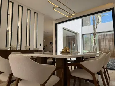 a dining room with a table and chairs at Golf 218 Playa Nueva Romana in San Pedro de Macorís