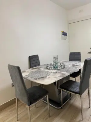 a dining room with a table and chairs at Lujoso townhouse en Boca Chica in Boca Chica