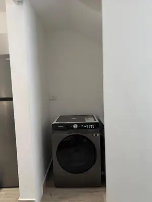 a washer and dryer in a small room at Lujoso townhouse en Boca Chica in Boca Chica