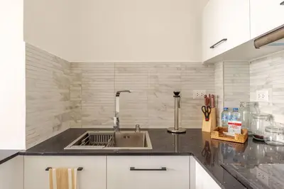 a kitchen with a sink and a counter top at Cana Rock Star in Punta Cana