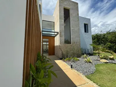 a house with a walkway leading to the front door at Golf 218 Nueva Romana Beach in San Pedro de Macorís