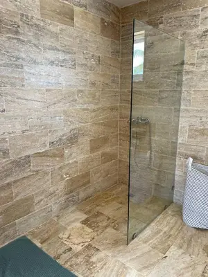 a bathroom with a shower with a glass door at Punta Popy 3BR Duplex with Pool, Walk to Beach in Las Terrenas