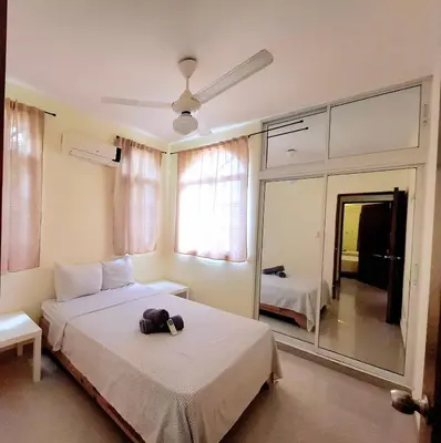 a bedroom with a bed with a hat and a mirror at Beach Apartment with Pool - Costambar in Las Flores
