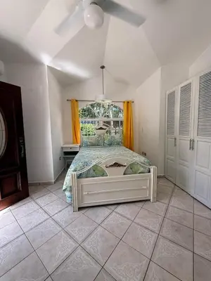 a bedroom with a large bed in a room at Villa Las Tortugas # 2 in Sousa in Sosúa