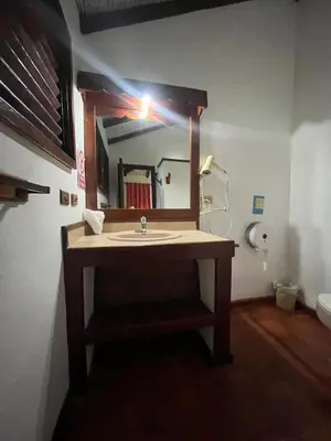 a bathroom with a sink and a mirror at Hotel palococo in Las Terrenas