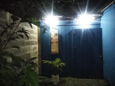 a blue wall with lights on top of it at enjoy the nature of the countryside in Bonao