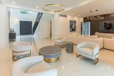a living room with a couch and a table and chairs at Casa Deco in La Romana