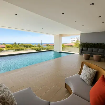 a living room with a swimming pool and a couch at Apto céntrico con piscina, gym y una hermosa vista a la ciudad in Santo Domingo
