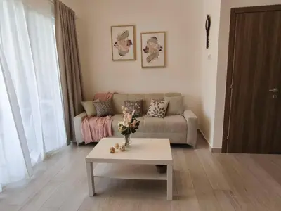 a living room with a couch and a coffee table at Apartamento Cómodo en Punta Cana in Punta Cana
