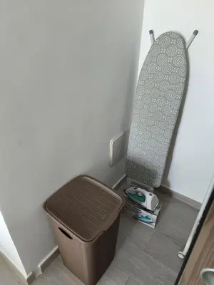 a trash can in the corner of a room at Apartamento Cómodo en Punta Cana in Punta Cana
