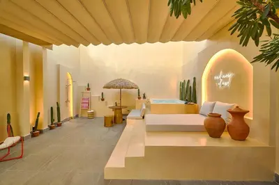 a room with a bed and vases on the floor at ®{Tulum~Experience}@Downtown PoolViewPenthouse in Santo Domingo