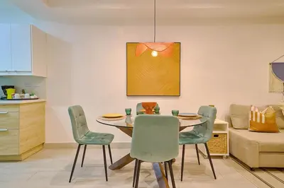 a dining room with a table and chairs at ®{Tulum~Experience}@Downtown PoolViewPenthouse in Santo Domingo