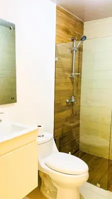 a bathroom with a toilet and a shower and a sink at Apartamento en Boca Chica T1 302 in Boca Chica