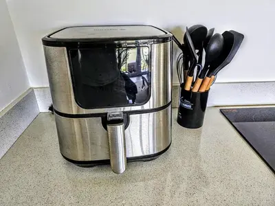 a small appliance sitting on a counter with utensils at NEW Luxury at Sosua Ocean Village Laguna City in Sosúa