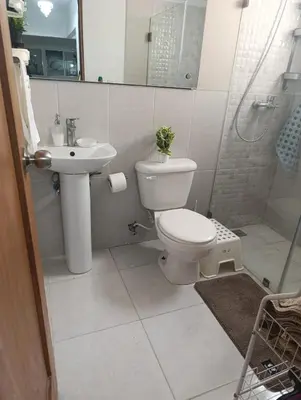 a bathroom with a toilet and a sink and a shower at Comfort, safety and close to everything in Los Paredones
