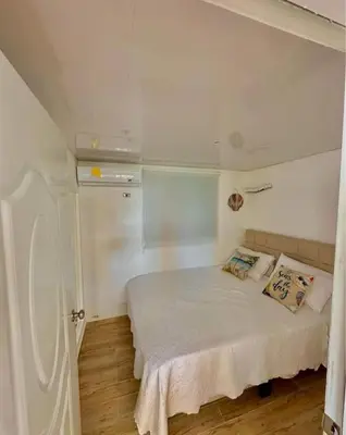 a bedroom with a bed in a small room at Emmanuel villas luxury in Puerto Plata
