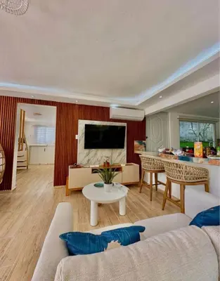 a living room with a couch and a table at Emmanuel villas luxury in Puerto Plata