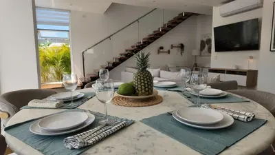 a dining room table with a pineapple on top of it at Beach House With Private Pool in Las Terrenas