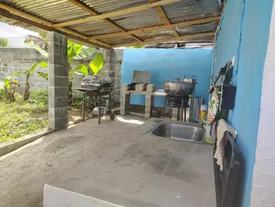 a kitchen with a sink in a blue wall at Country house with Jacuzzi and BBQ