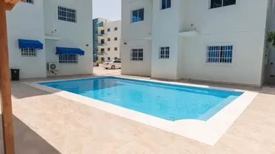 a large swimming pool in the middle of a building at Vista Azul Boca Chica Accommodation in El Higo