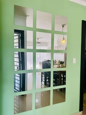 a room with a large mirror on the wall at Modern, Elegant & Comfortable Apartment in El Seis