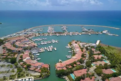 an aerial view of a marina with boats in the water at Casa de Campo Luxury Villa with private Pool & Jacuzzi, Near Beach, Marina, Golf, Restaurants & Altos de Chavon in La Romana