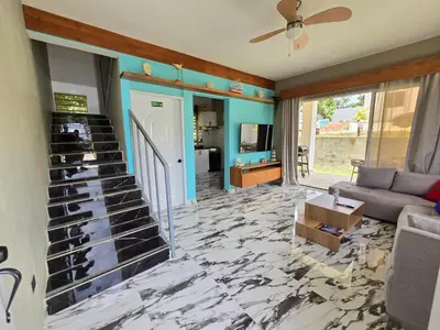 a living room with a marble floor and a staircase at Rest in Paradise, Pool, Beach and Terrace in Sánchez
