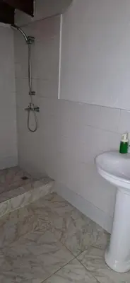 a bathroom with a toilet and a sink in it at Casa Perez CCC in Juan Dolio