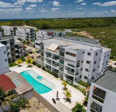 an aerial view of an apartment complex with a swimming pool at Le Camere Del Maestro in Bayahibe