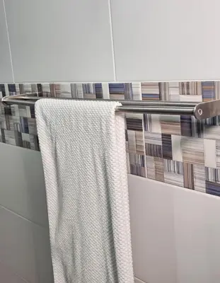 a towel hanging on a towel rack in a bathroom at Luxury apartment in Santo Domingo Este in Juan López