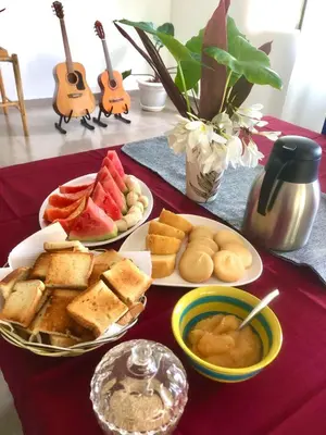 a table with three plates of food on a table at Villa KAMBUSA appartamento SOFIA in Las Galeras