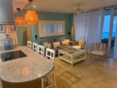 a living room with a couch and a table at Juan Dolio Beach, Marbella Ocean Front in Colorado