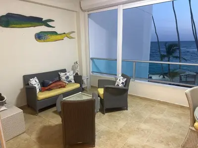 a living room with a view of the ocean at Juan Dolio Beach, Marbella Ocean Front in Colorado