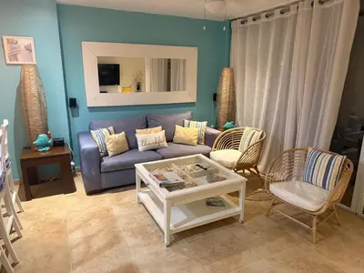 a living room with a couch and two chairs at Juan Dolio Beach, Marbella Ocean Front in Colorado
