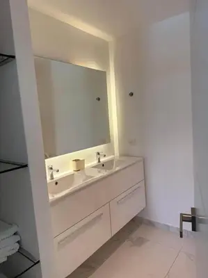 a bathroom with a sink and a large mirror at Escapada Cana Rock con Piscina y Club de Playa in Punta Cana
