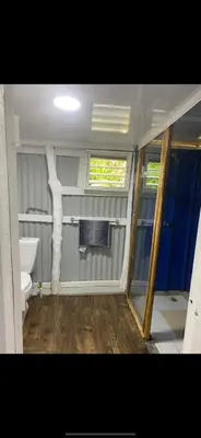 a small bathroom with a toilet and a window at La paz y tranquilidad